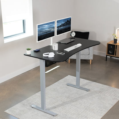 Sit to stand height adjustable electric desk with push button memory controller for ergonomic office workstation.