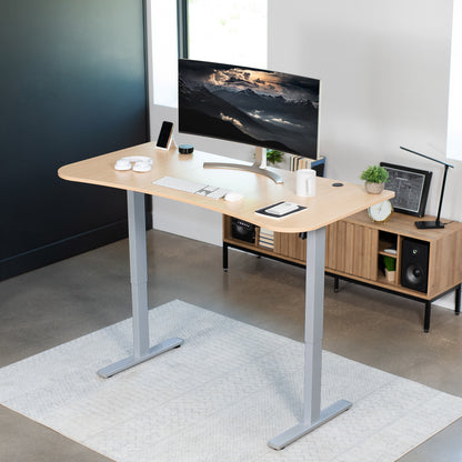 Sit to stand height adjustable electric desk with push button memory controller for ergonomic office workstation.