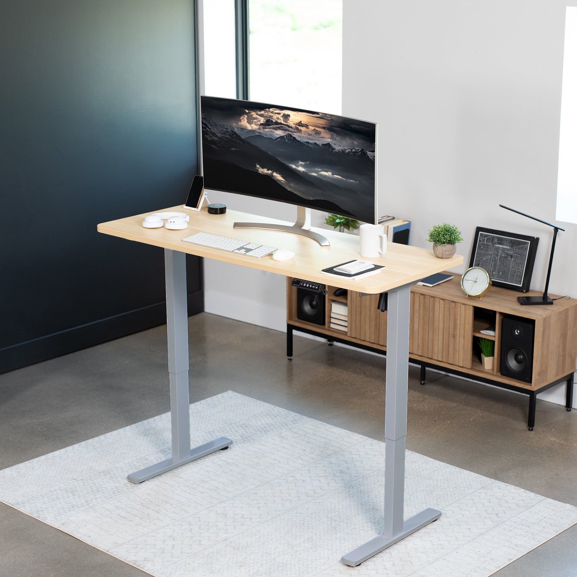 Sturdy ergonomic sit or stand active desk workstation with adjustable height using smart control panel.