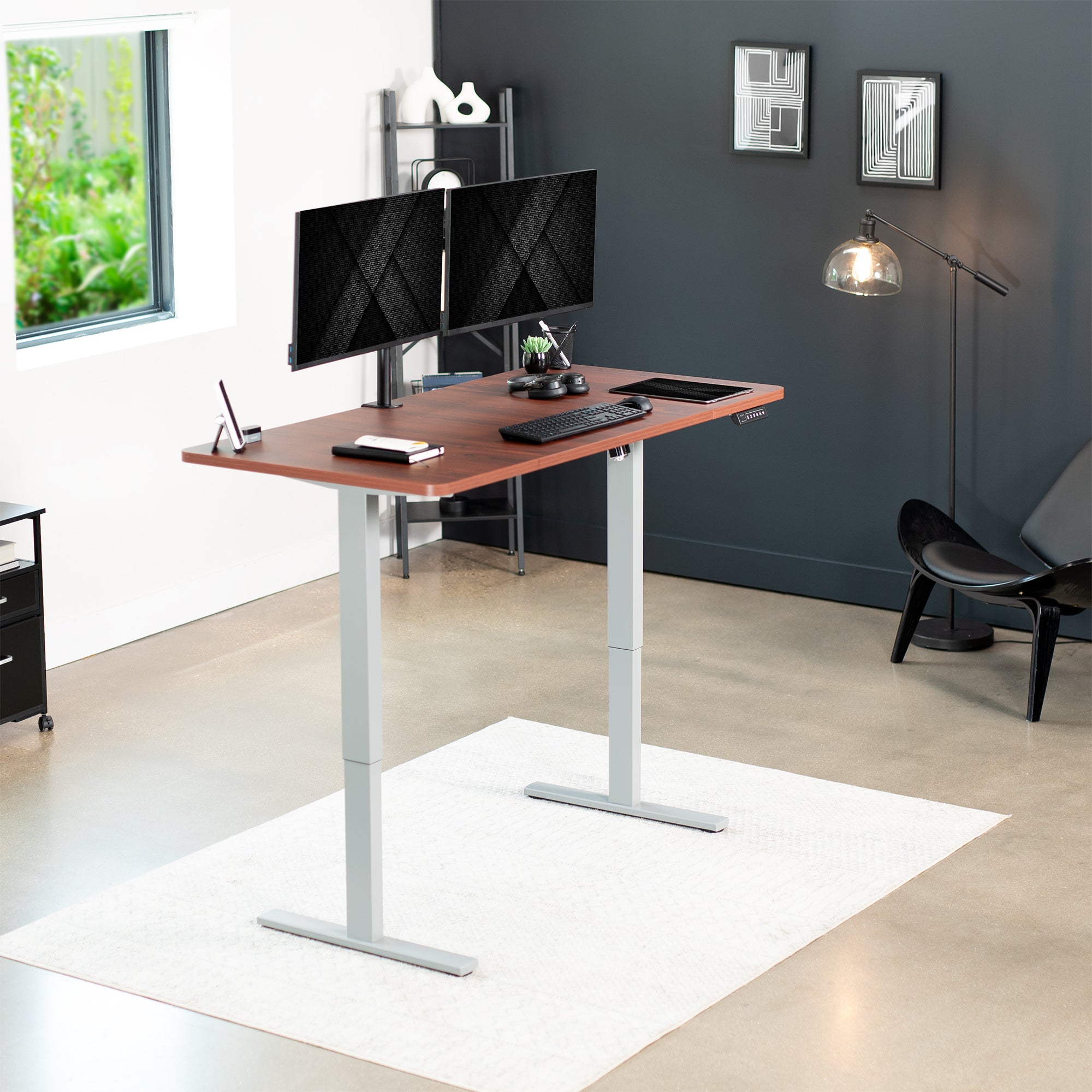 Sturdy ergonomic sit or stand active desk workstation with adjustable height using smart control panel.