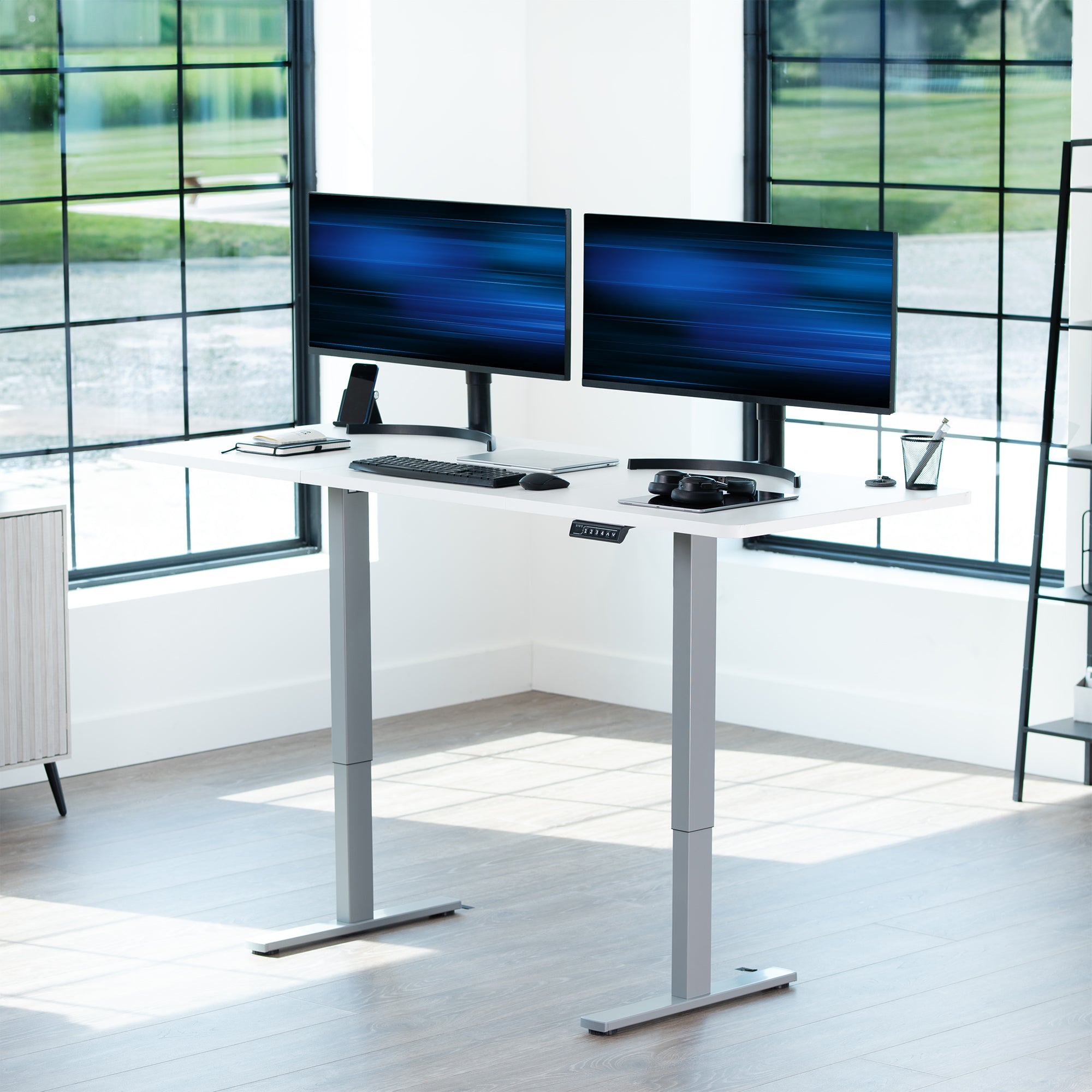 Large sturdy sit or stand modern desk with electric height adjustment options.