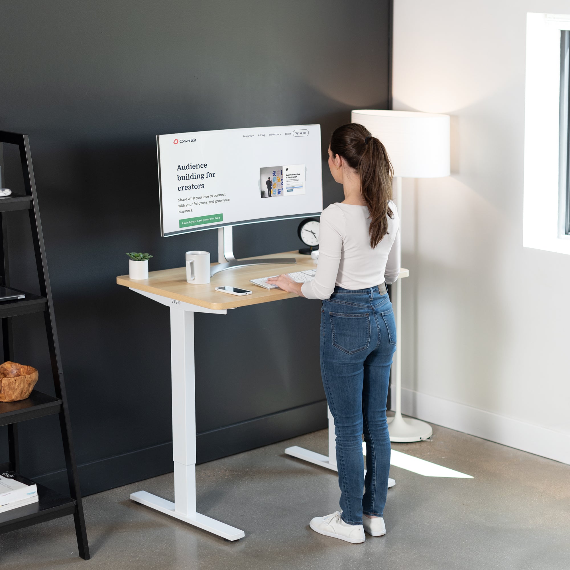 Sturdy ergonomic sit or stand active desk workstation with adjustable height using smart control panel.