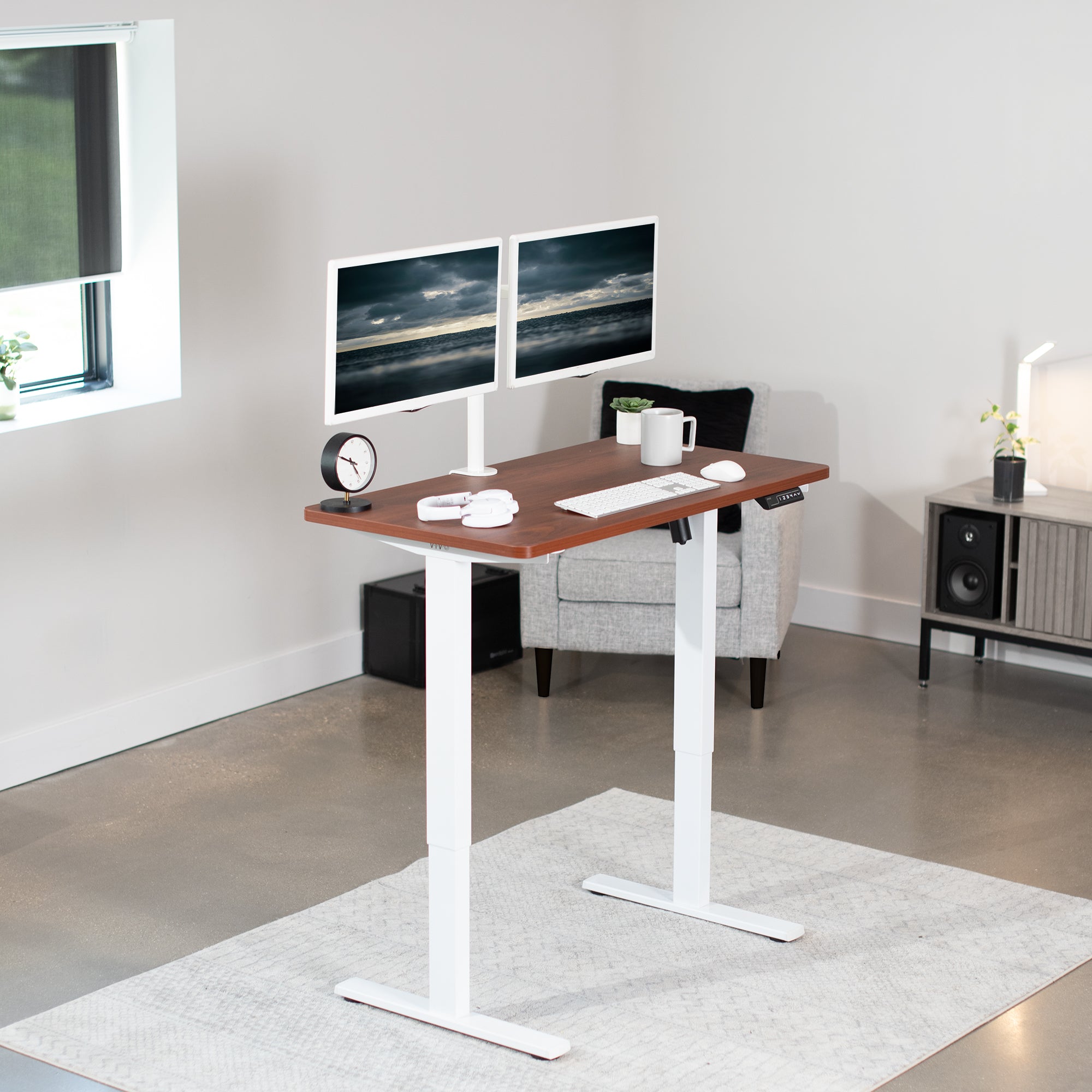 Sturdy ergonomic sit or stand active desk workstation with adjustable height using smart control panel.