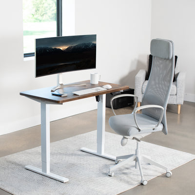 Rustic, sturdy ergonomic sit or stand active desk workstation with adjustable height using smart control panel.
