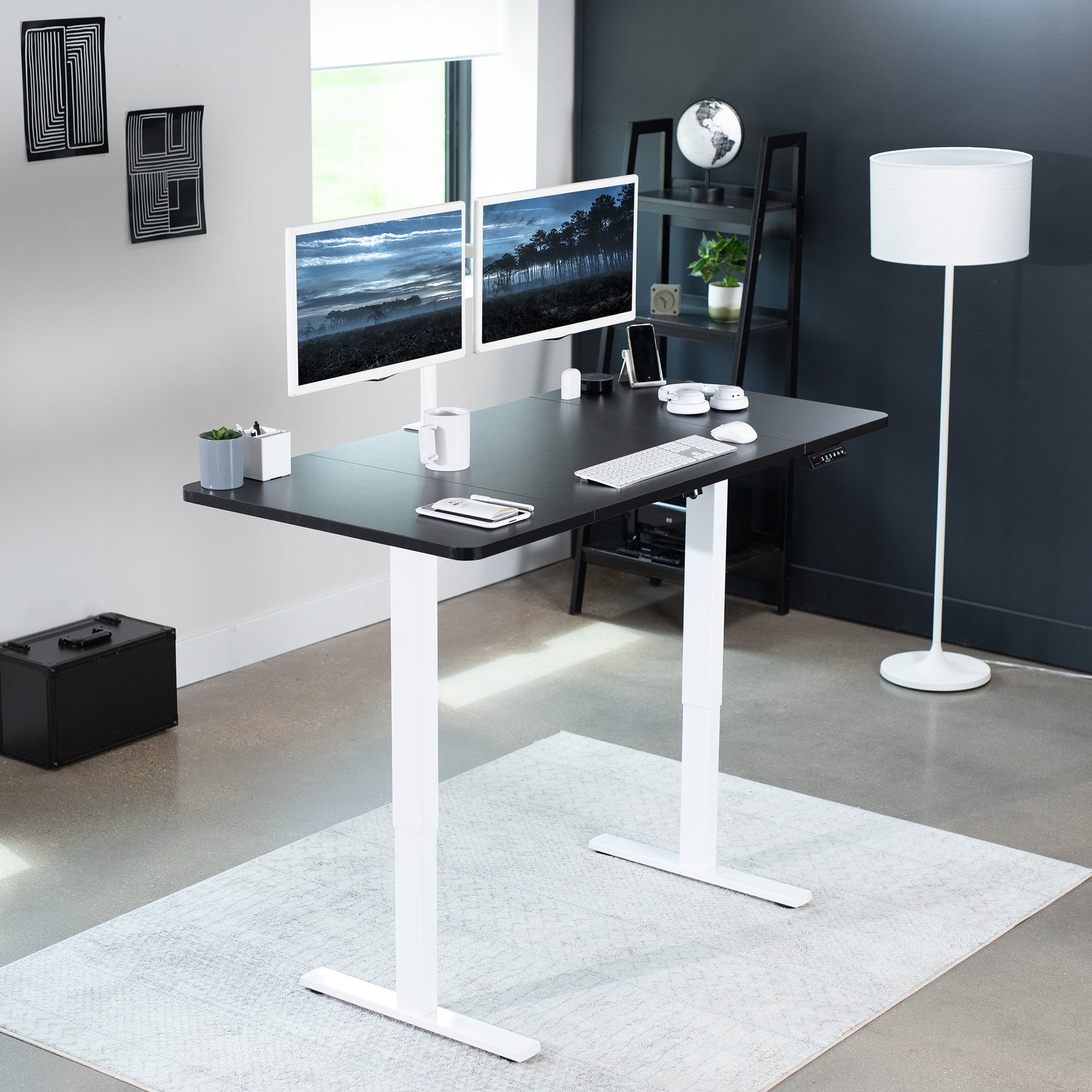 Sturdy ergonomic sit or stand active desk workstation with adjustable height using smart control panel.