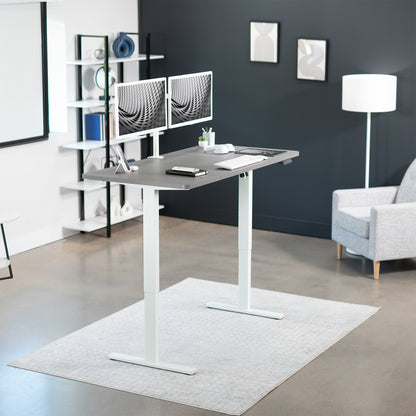 Sturdy ergonomic sit or stand active desk workstation with adjustable height using smart control panel.