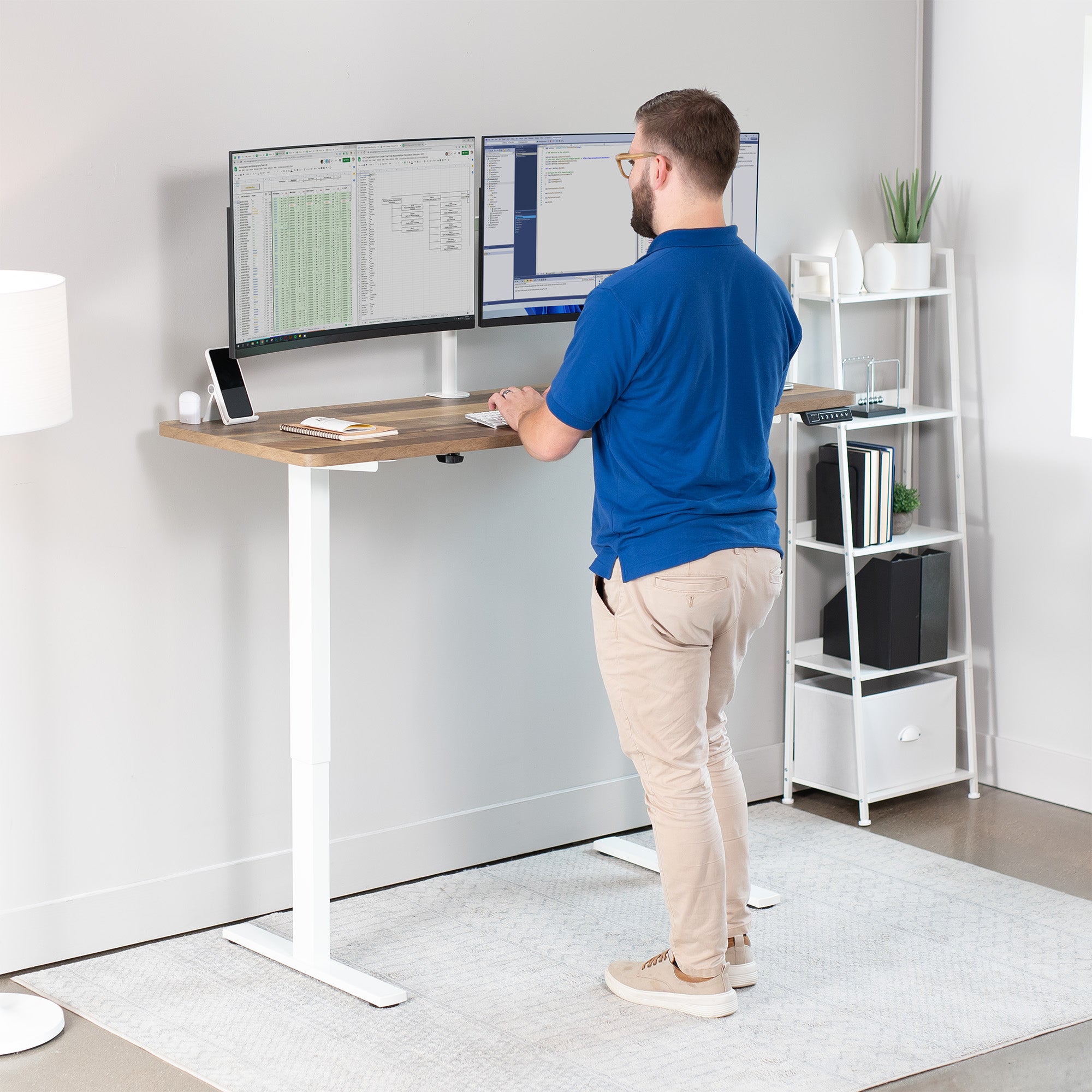 Sturdy wood plank pattern ergonomic sit or stand active desk workstation with adjustable height using smart control panel.