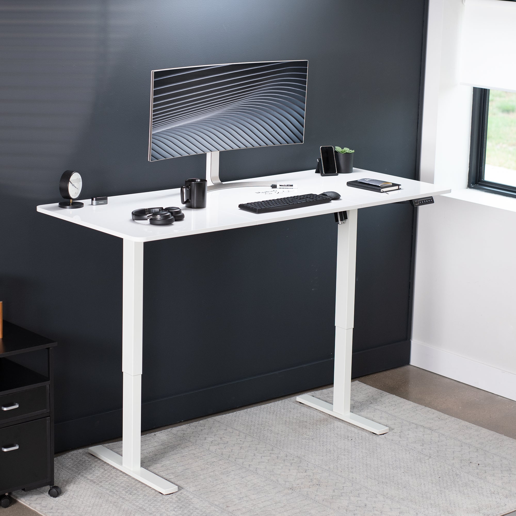 Large sturdy sit or stand dry erase desktop workstation with adjustable height using smart control panel.