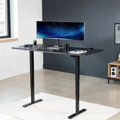 Heavy-duty electric height adjustable desktop workstation for active sit or stand efficient workspace.