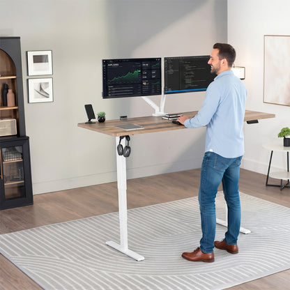 Heavy-duty electric height adjustable desktop workstation for active sit or stand efficient workspace.