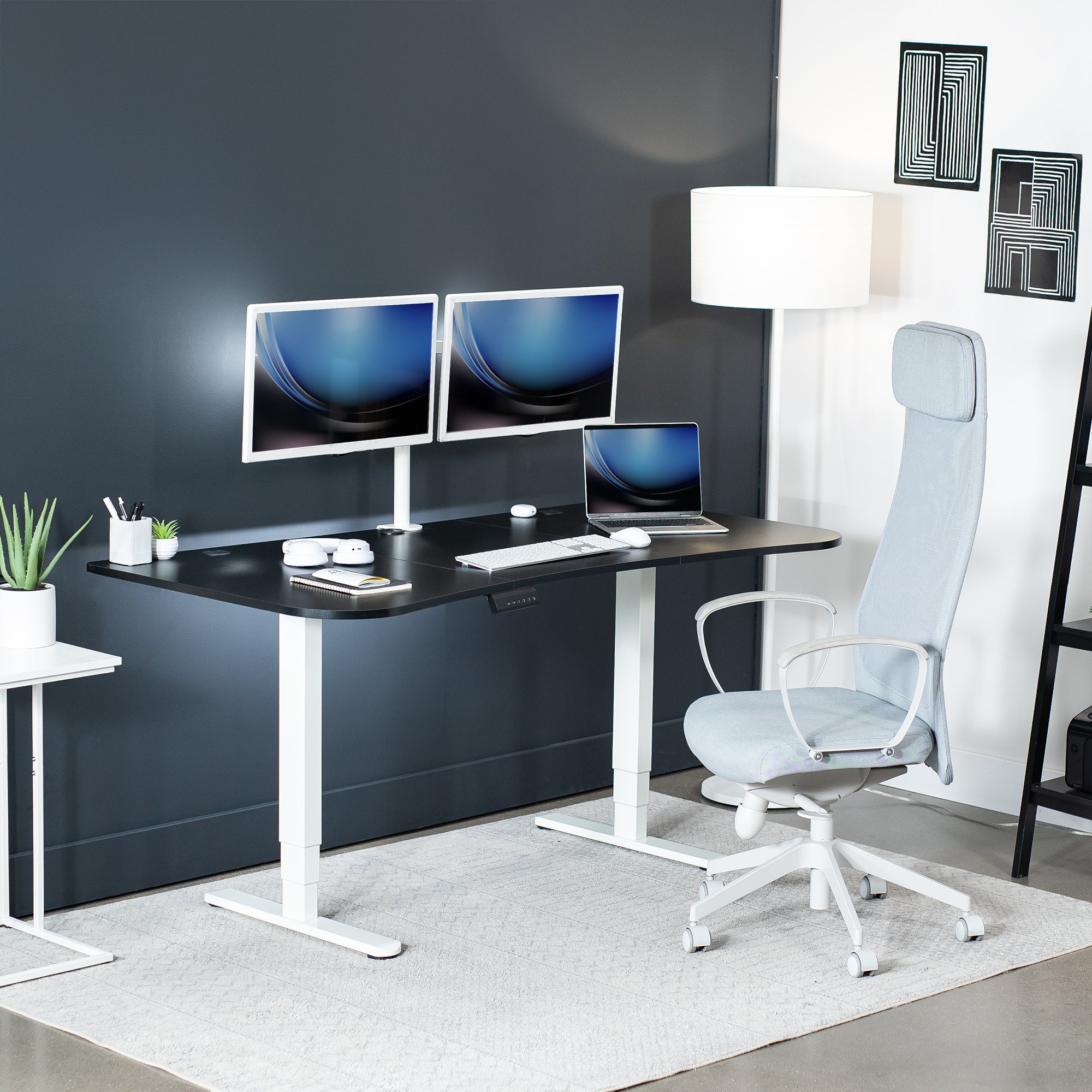 Large standing desk featuring smooth height adjustment, powerful dual motors, and a simple push-button controller featuring memory presets.