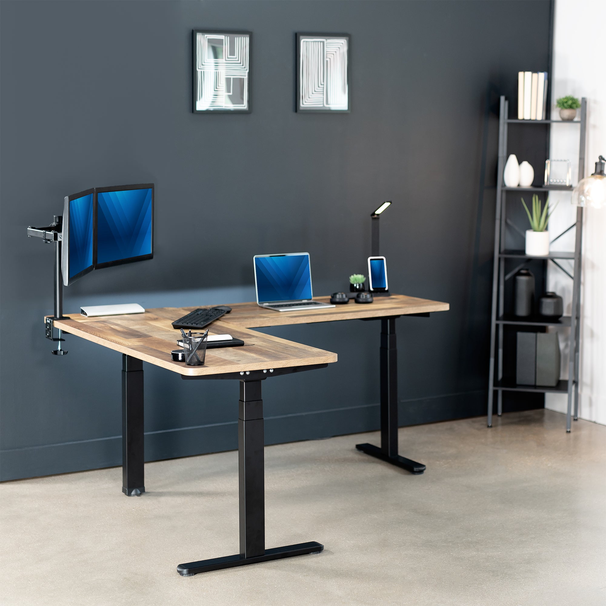 Heavy-duty electric height adjustable corner desk workstation for active sit or stand efficient workspace.