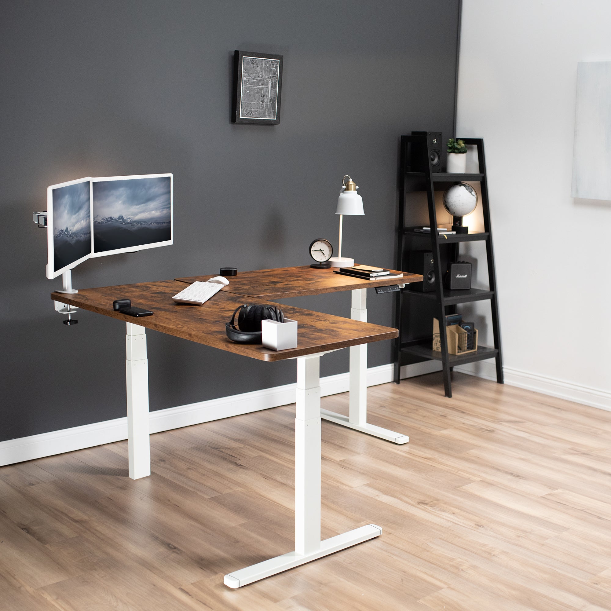 Heavy-duty electric height adjustable corner desk workstation for active sit or stand efficient workspace.