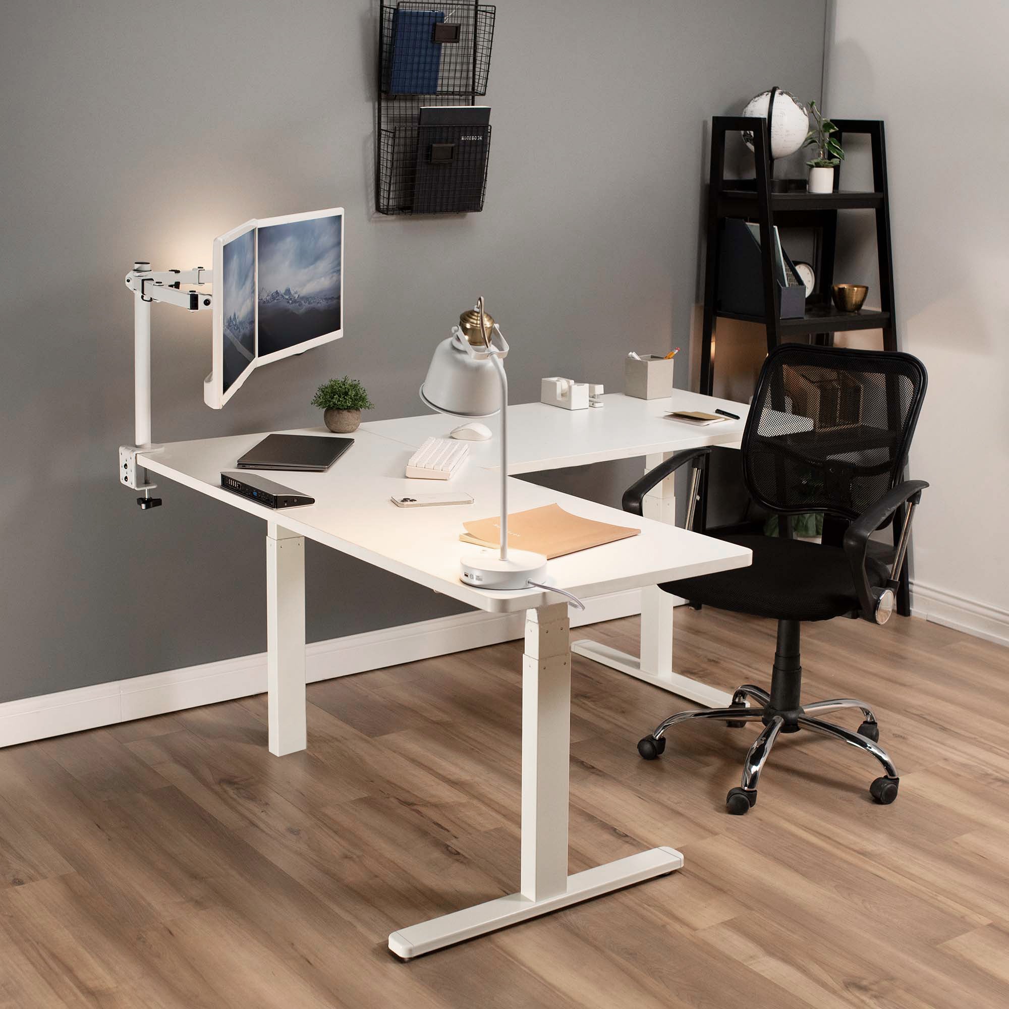 Heavy-duty electric height adjustable corner desk workstation for active sit or stand efficient workspace.