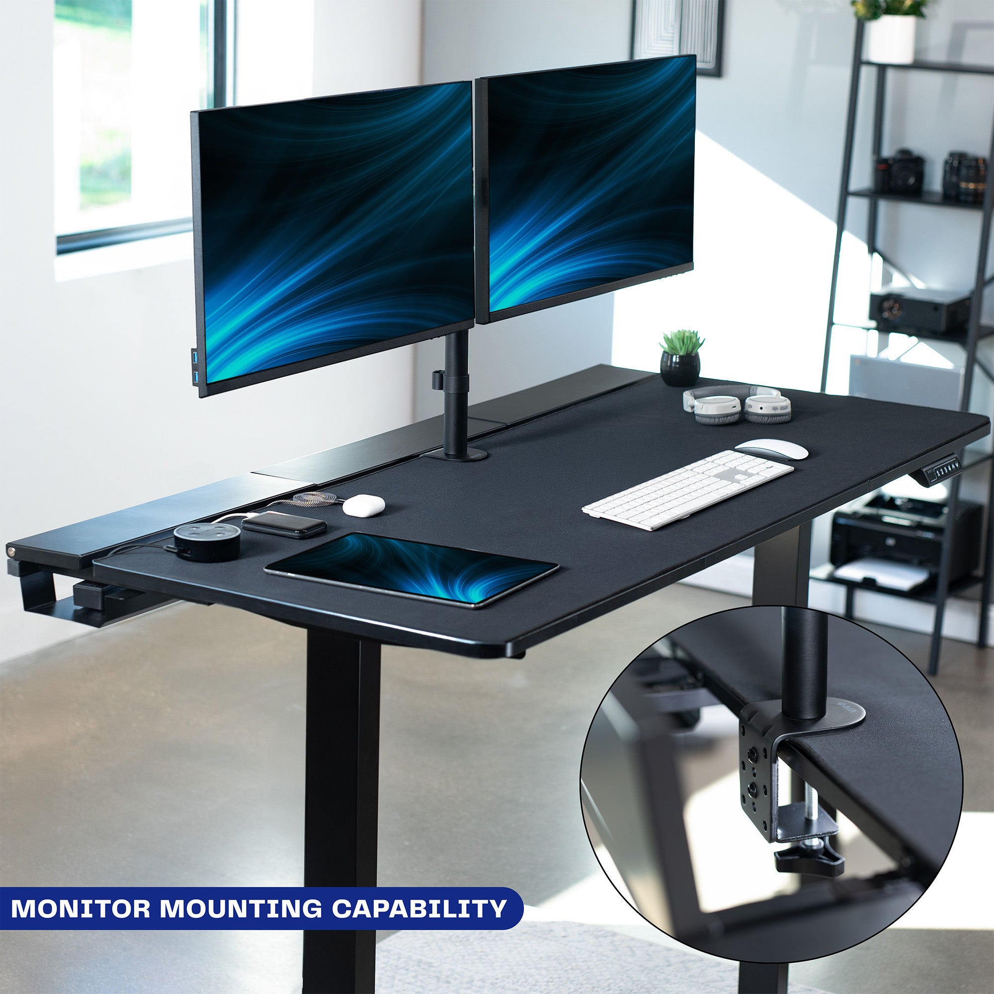 Dual motor electric desk with concealed cable management/storage trays and a full-sized desk pad, featuring memory controller height adjustment with memory settings.