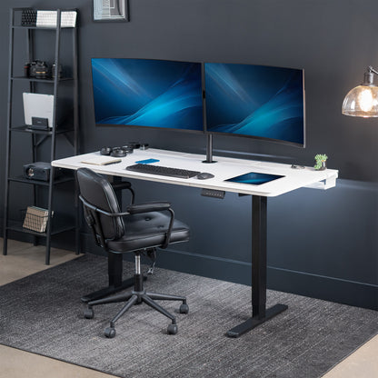 Dual motor electric desk with concealed cable management/storage trays and a full-sized desk pad, featuring memory controller height adjustment with memory settings.