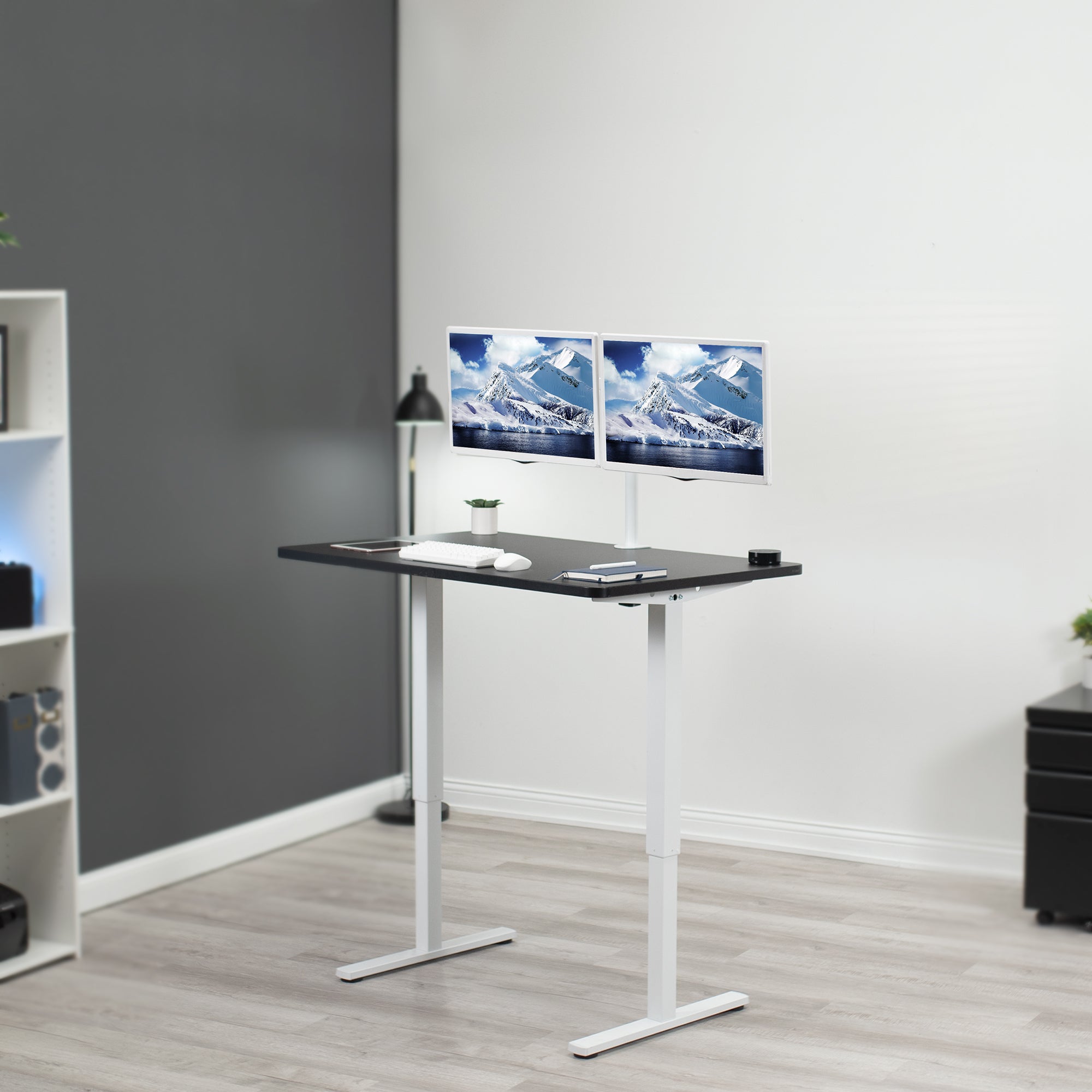 Manual hand crank height adjustable desk for sit or stand active workstation.