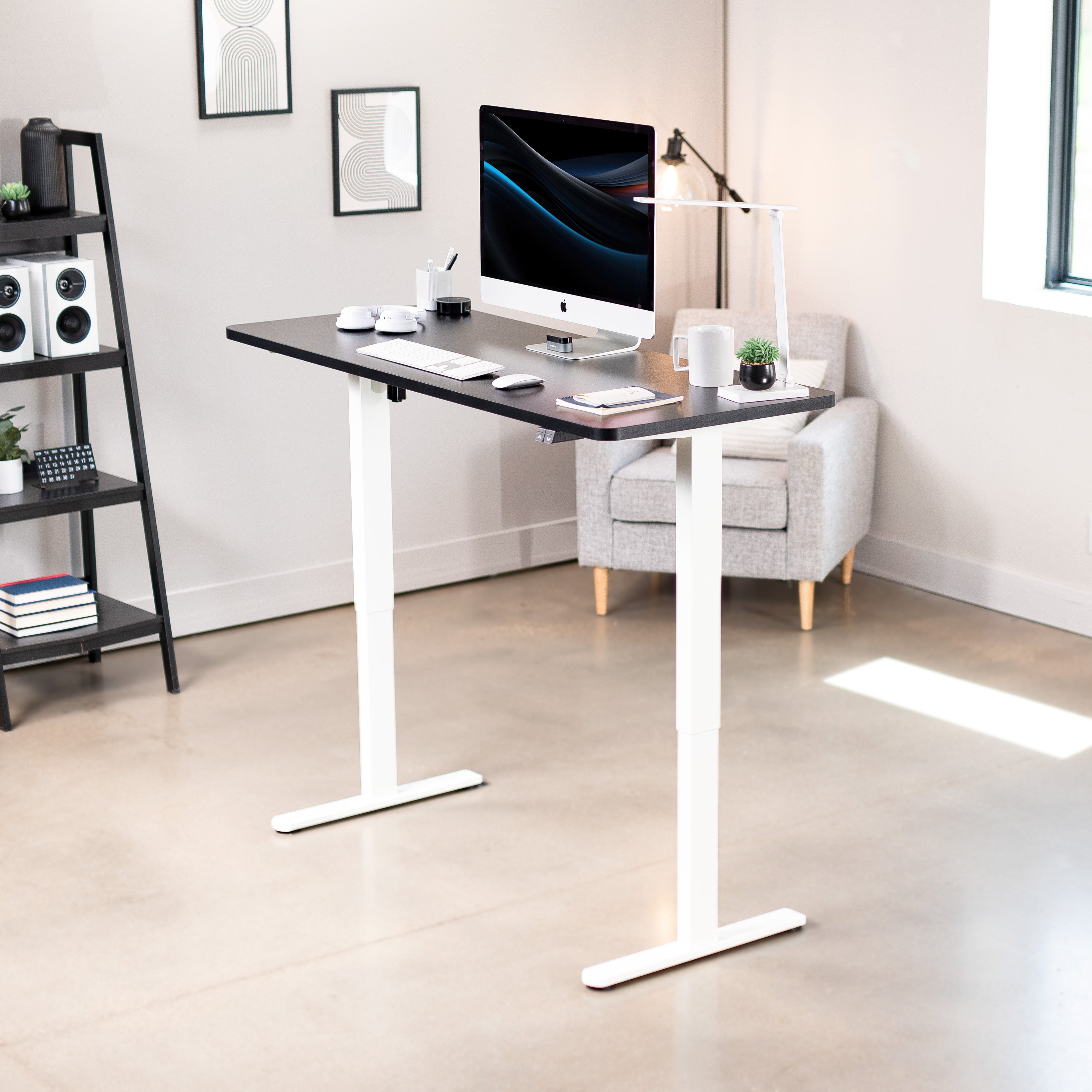 Heavy-duty electric height adjustable desktop workstation for active sit or stand efficient workspace.