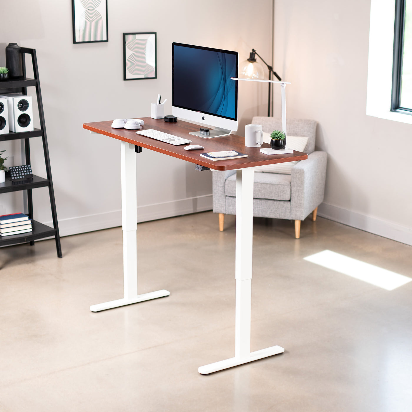 Heavy-duty electric height adjustable desktop workstation for active sit or stand efficient workspace.