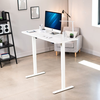 Heavy-duty electric height adjustable desktop workstation for active sit or stand efficient workspace.