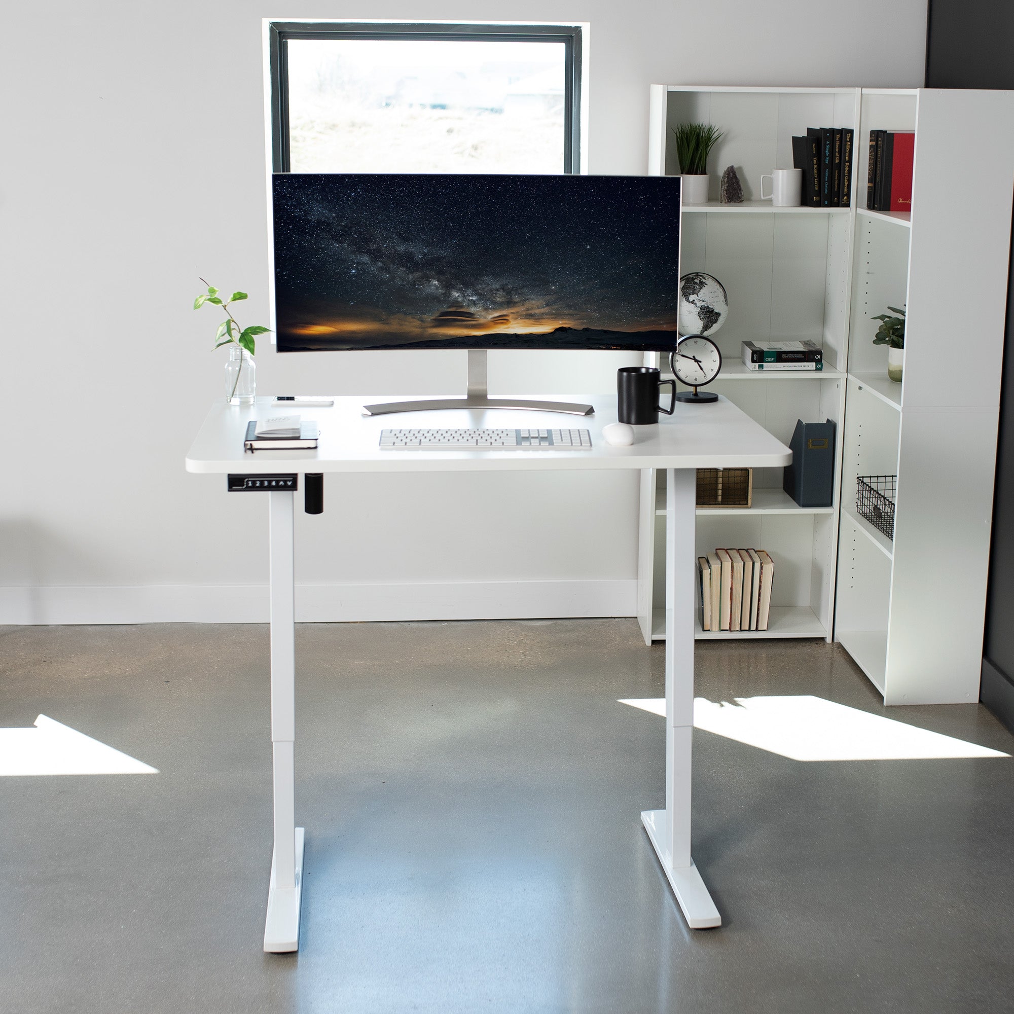 Sturdy ergonomic sit or stand active desk workstation with adjustable height using smart control panel.