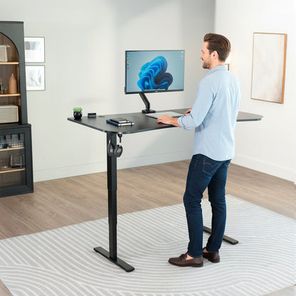 63” x 32” Electric Height Adjustable Stand Up Desk. Features a built-in power strip.