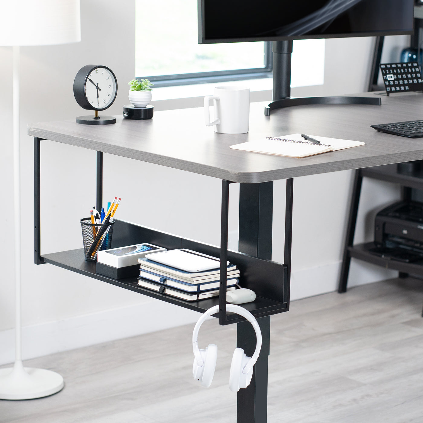 Sleek modern under desk shelf with safety back for flexible convenient storage and organization.