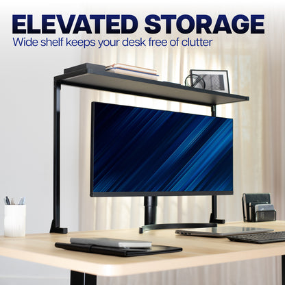 Clamp-on overhead desk shelf providing elevated storage above a monitor for office supplies and accessories