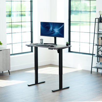 Dark Walnut 43in x 24in Particle Board Table Top on black frame in office setting