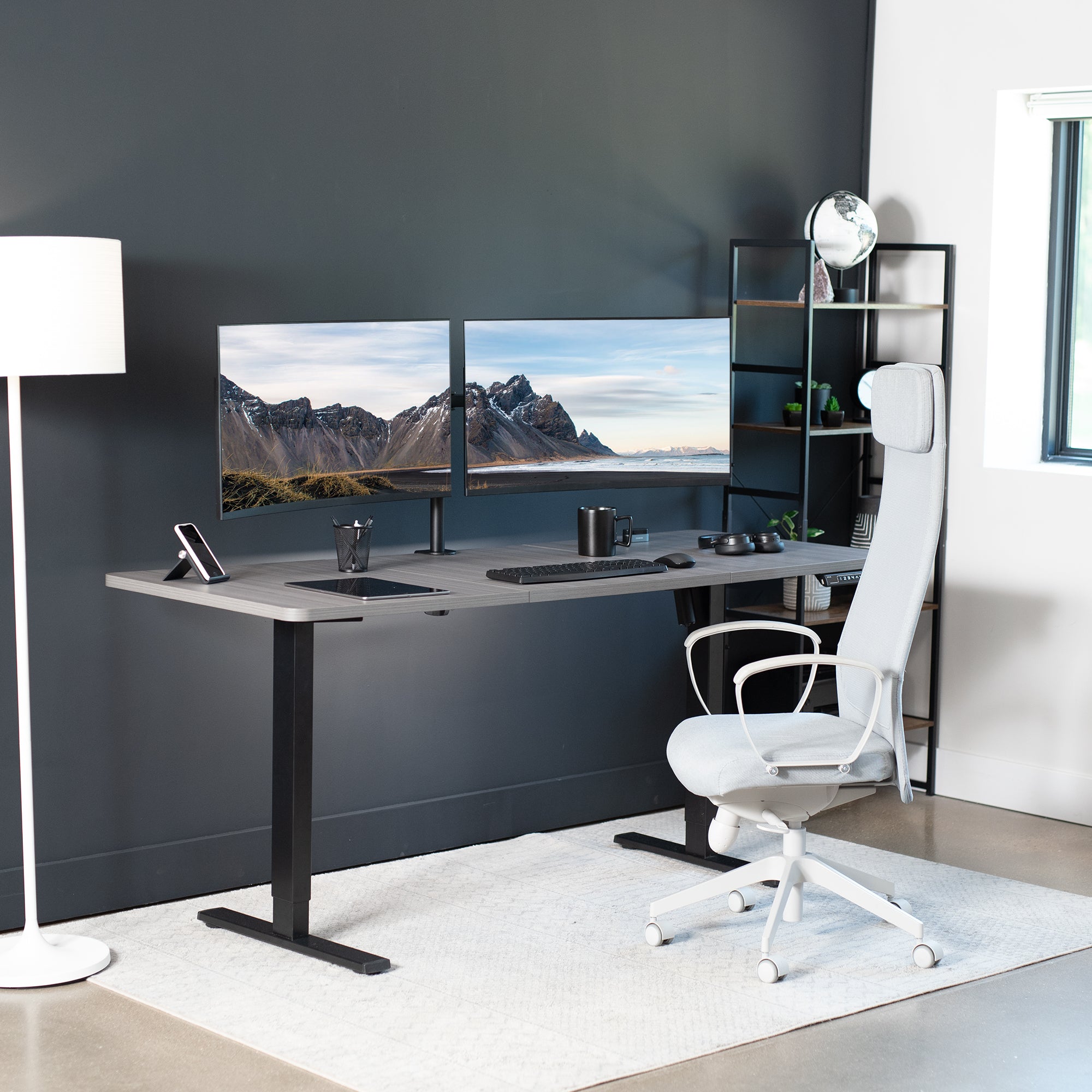 Durable sit to stand desk tabletop workstation with wide surface space.