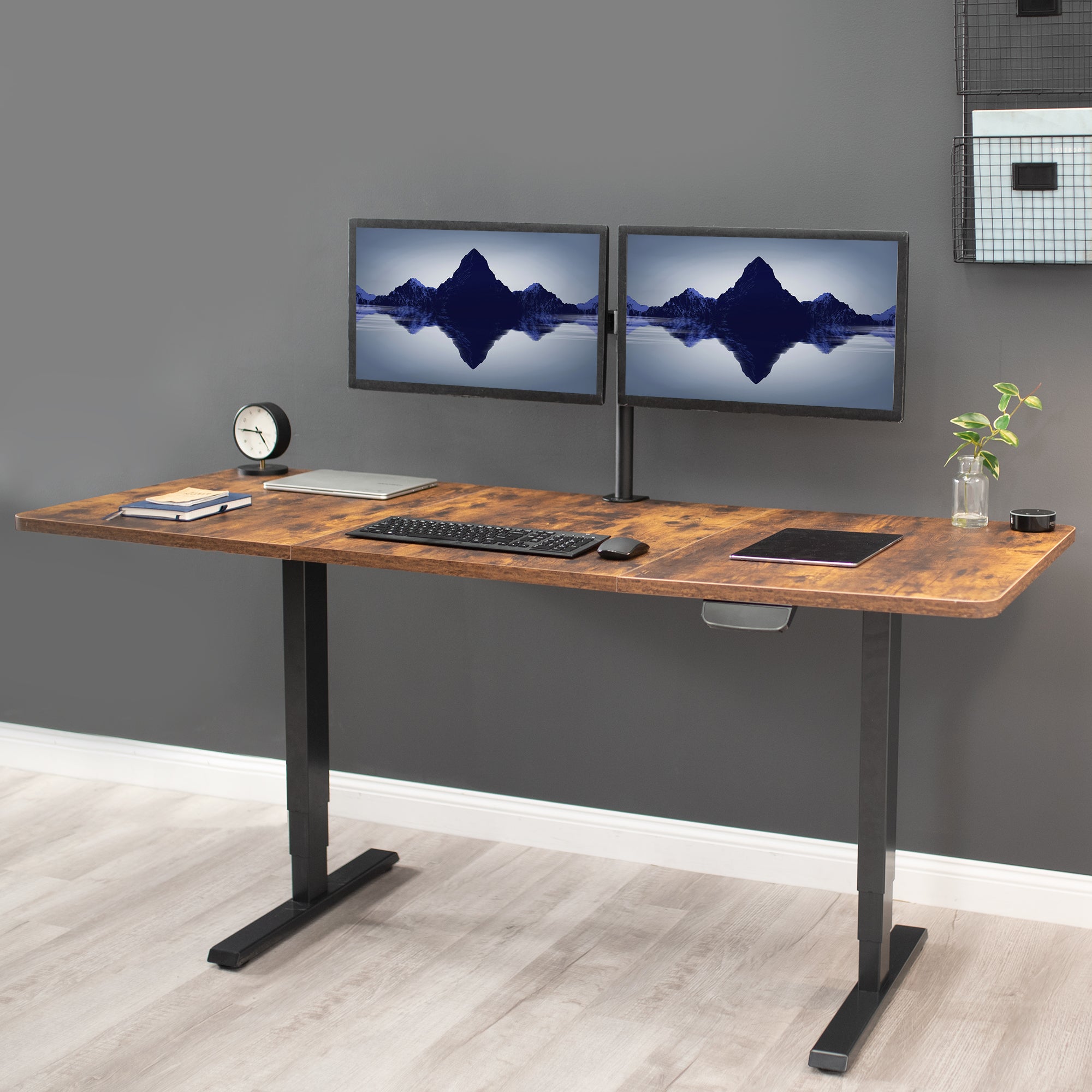 Durable sit to stand desk rustic tabletop workstation with wide surface space.