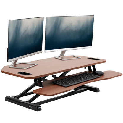 Heavy-duty height adjustable desk converter monitor riser with 2 tiers.