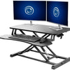 Sturdy height adjustable 2-tiered desk riser for ergonomic office workstation.