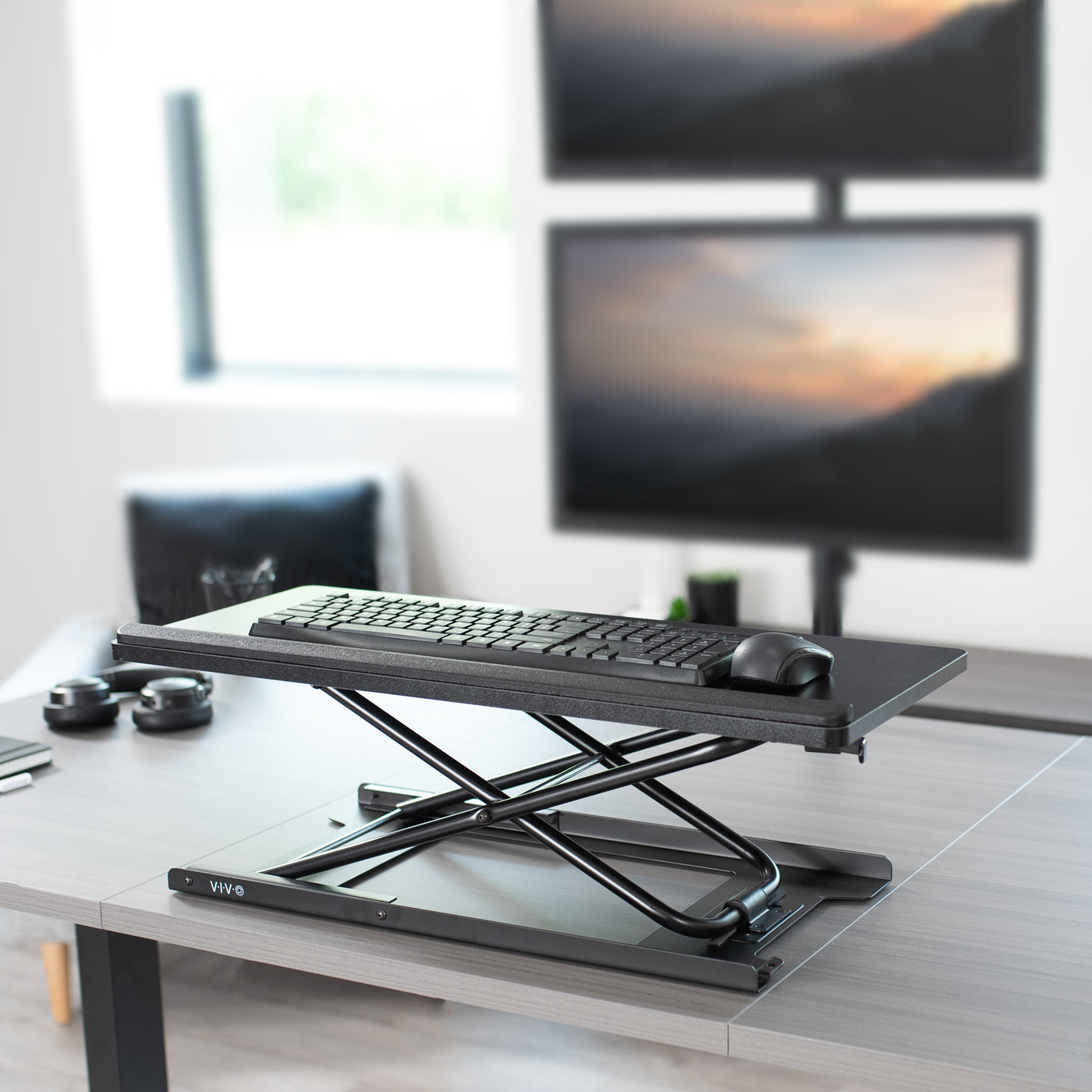 Transform your workspace with this height-adjustable keyboard riser from VIVO.