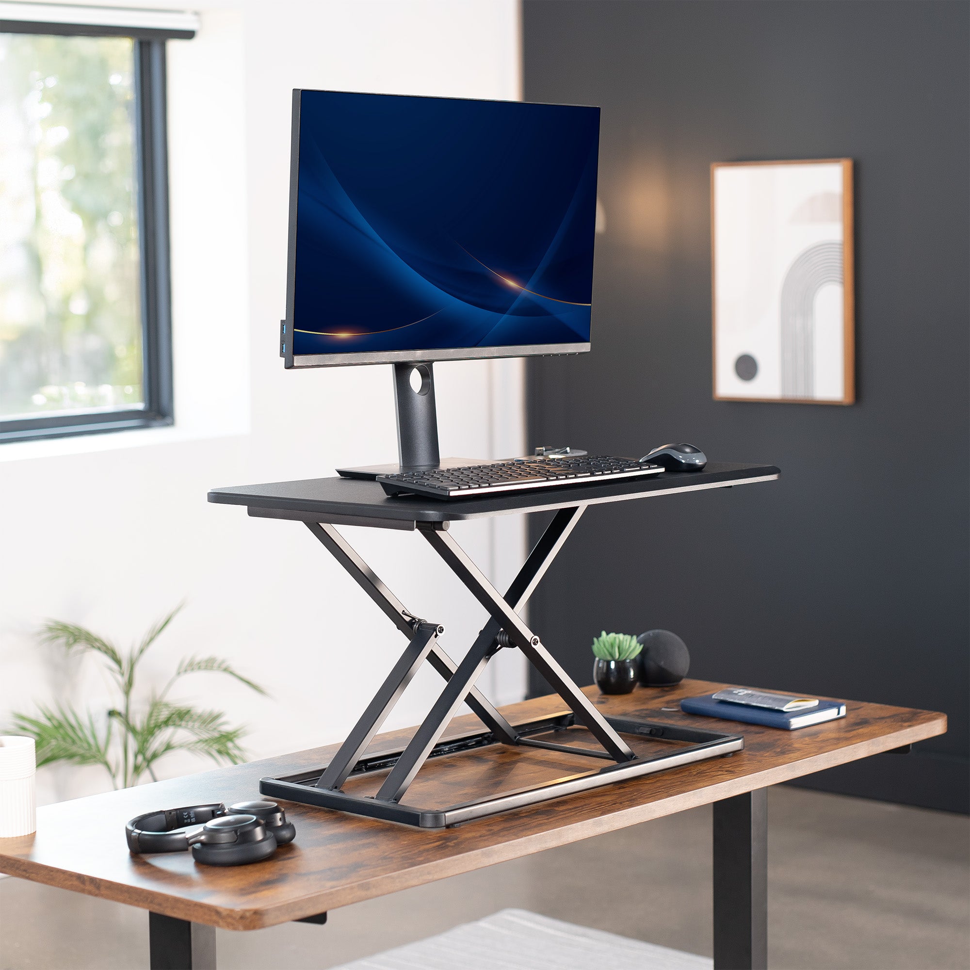 Heavy-duty height adjustable desk converter monitor riser.