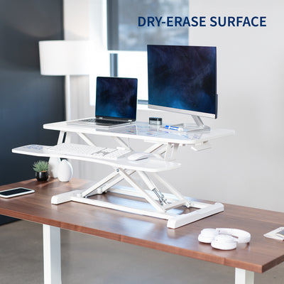 Sturdy height adjustable 2-tiered dry erase whiteboard desk riser for ergonomic office workstation.