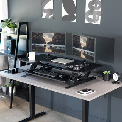 Modern workstation from VIVO with a sit-to-stand office desk setup.