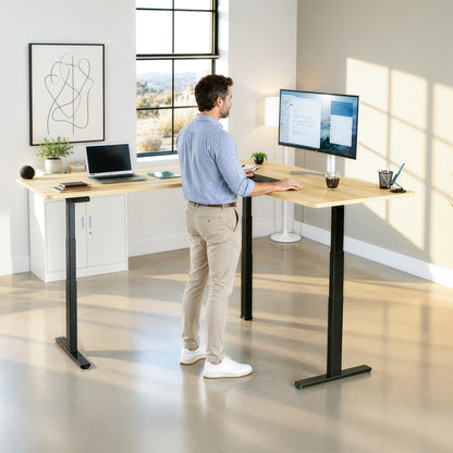 Model standing at a desk in a home office space, black desk frame with light wood top
