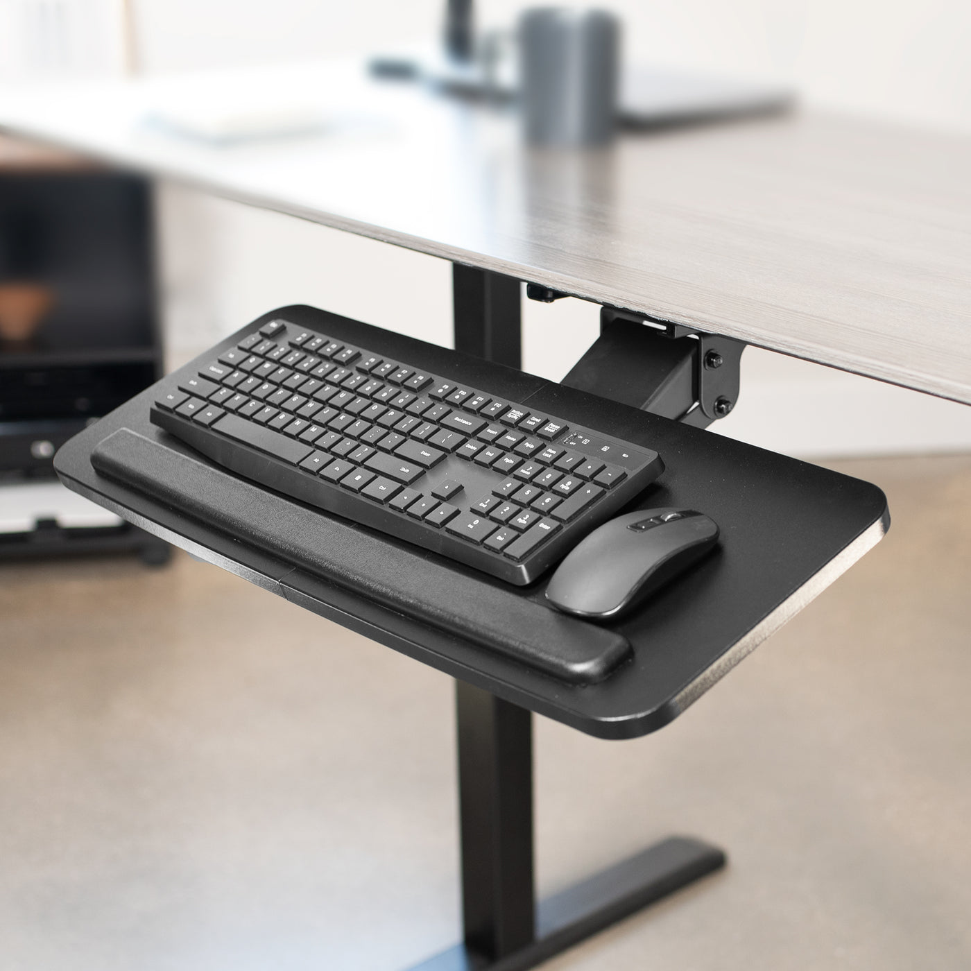 Ergonomic under desk keyboard tray mount with comfortable tilting angles for typing.