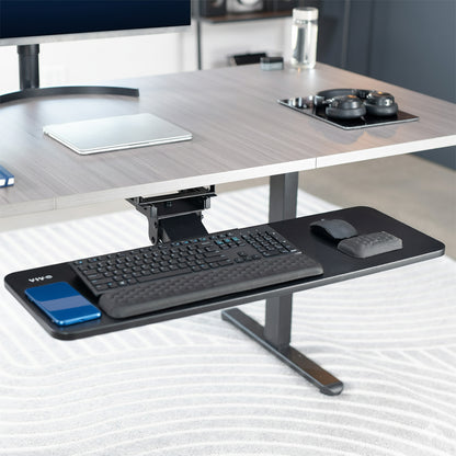 Adjustable under desk pull out keyboard tray mount with included padding.