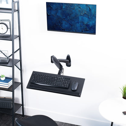 Sturdy steel pneumatic height adjustable keyboard tray wall mount with articulation.