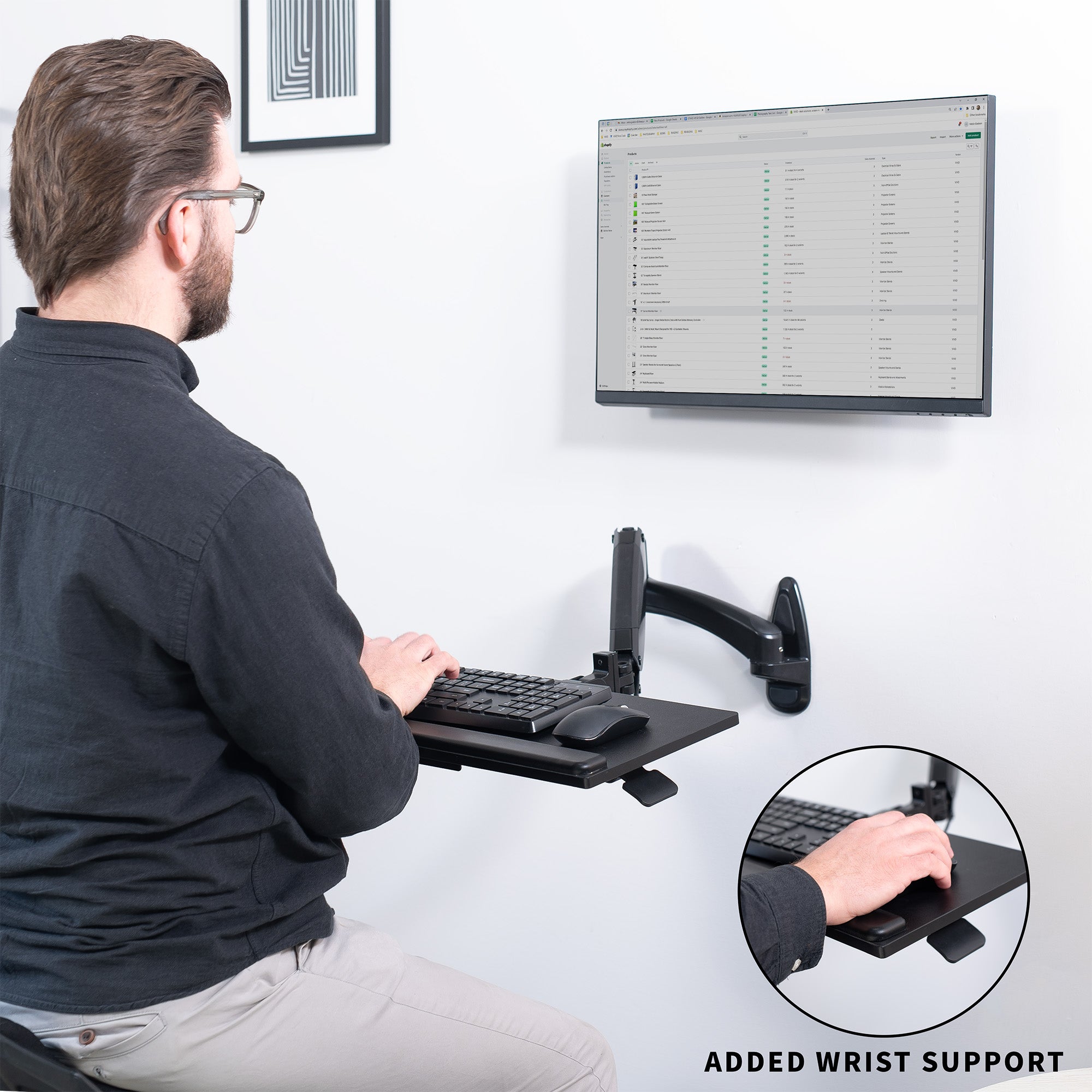 Sturdy steel pneumatic height adjustable keyboard tray wall mount with articulation.