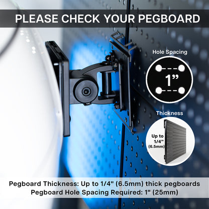 Black metal pegboard monitor mount mounted on a pegboard wall, with text reading 'PLEASE CHECK YOUR PEGBOARD' and circular specs for hole spacing and thickness.