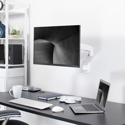 Sturdy adjustable pneumatic arm single monitor ergonomic wall mount that holds screens up to 32" in size.