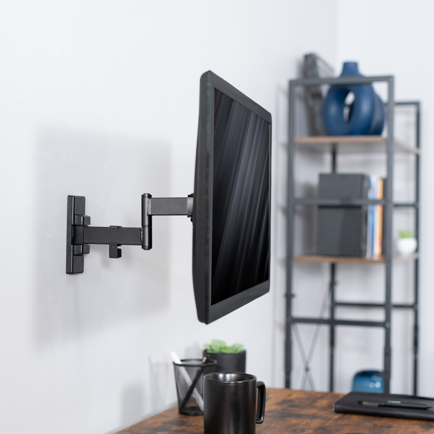 Sturdy adjustable single monitor ergonomic wall mount for office workstation.