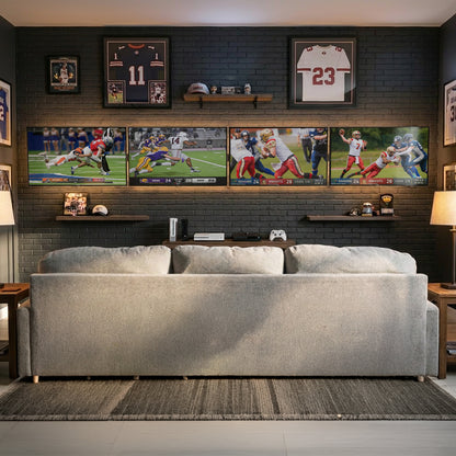1x4 Video Wall Mounts depicting football players in action across the four screens, displayed in a modern living room setting above a light gray sofa against a dark brick wall.