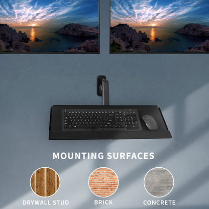 Dual monitor wall mount and height adjustable keyboard tray create a complete wall-mounted workstation.