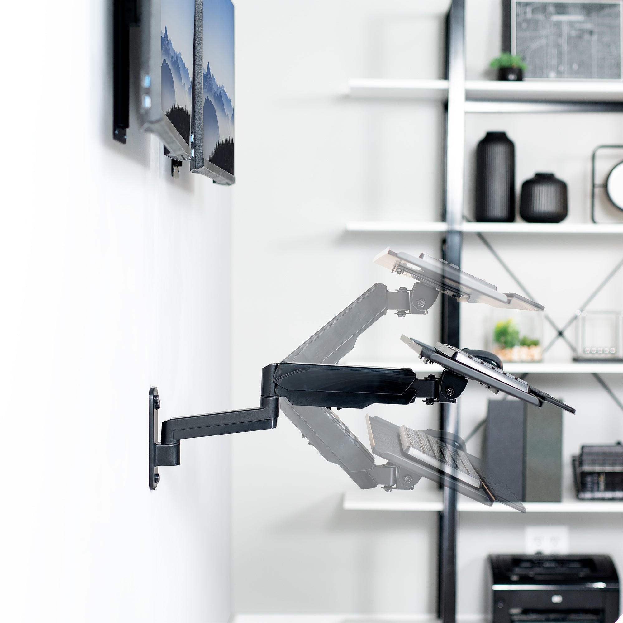 Dual monitor wall mount and height adjustable keyboard tray create a complete wall-mounted workstation.