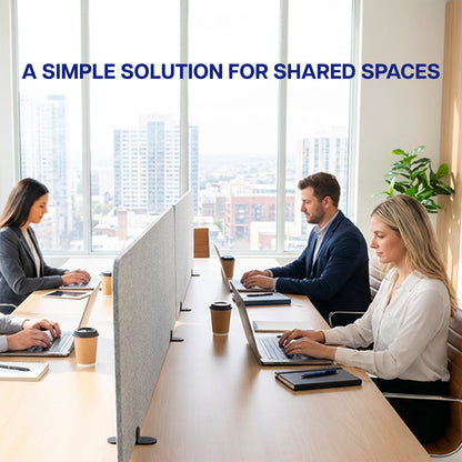 Three people working at a long table with laptops in an office setting with desk Privacy Panels