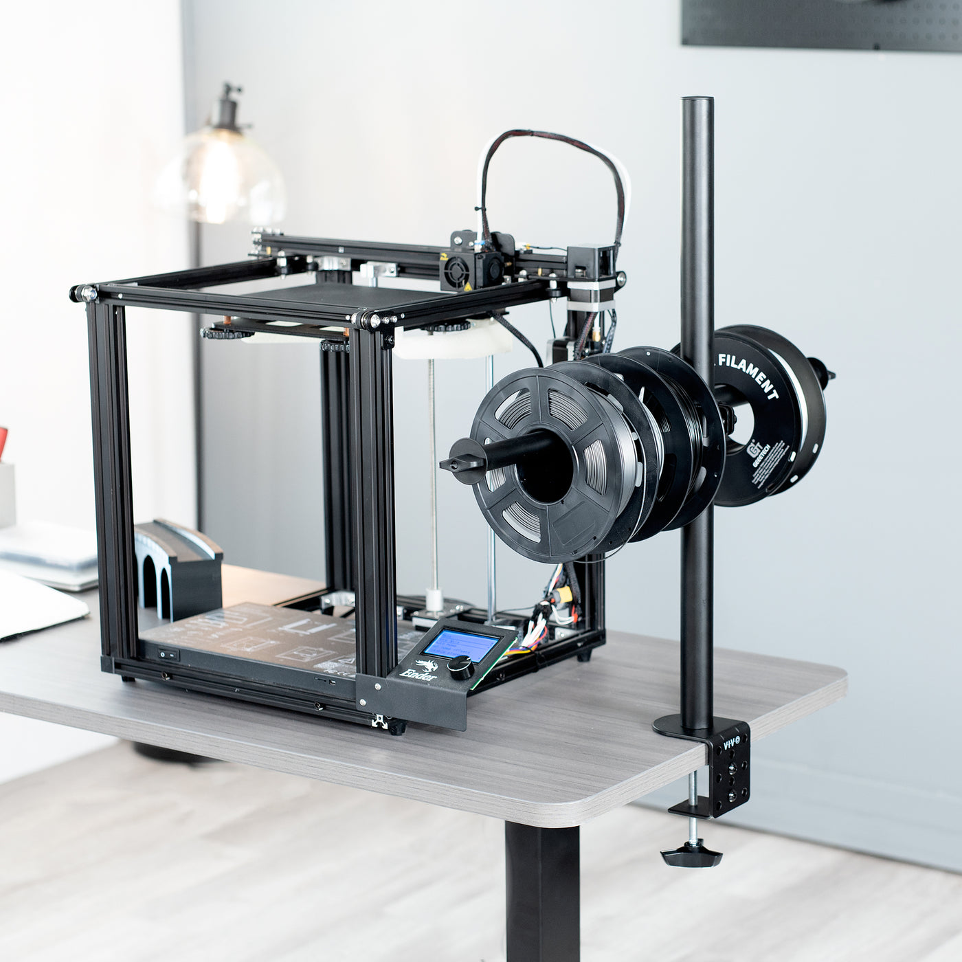 Sturdy clamp-on height adjustable reel holder for 3D printer.